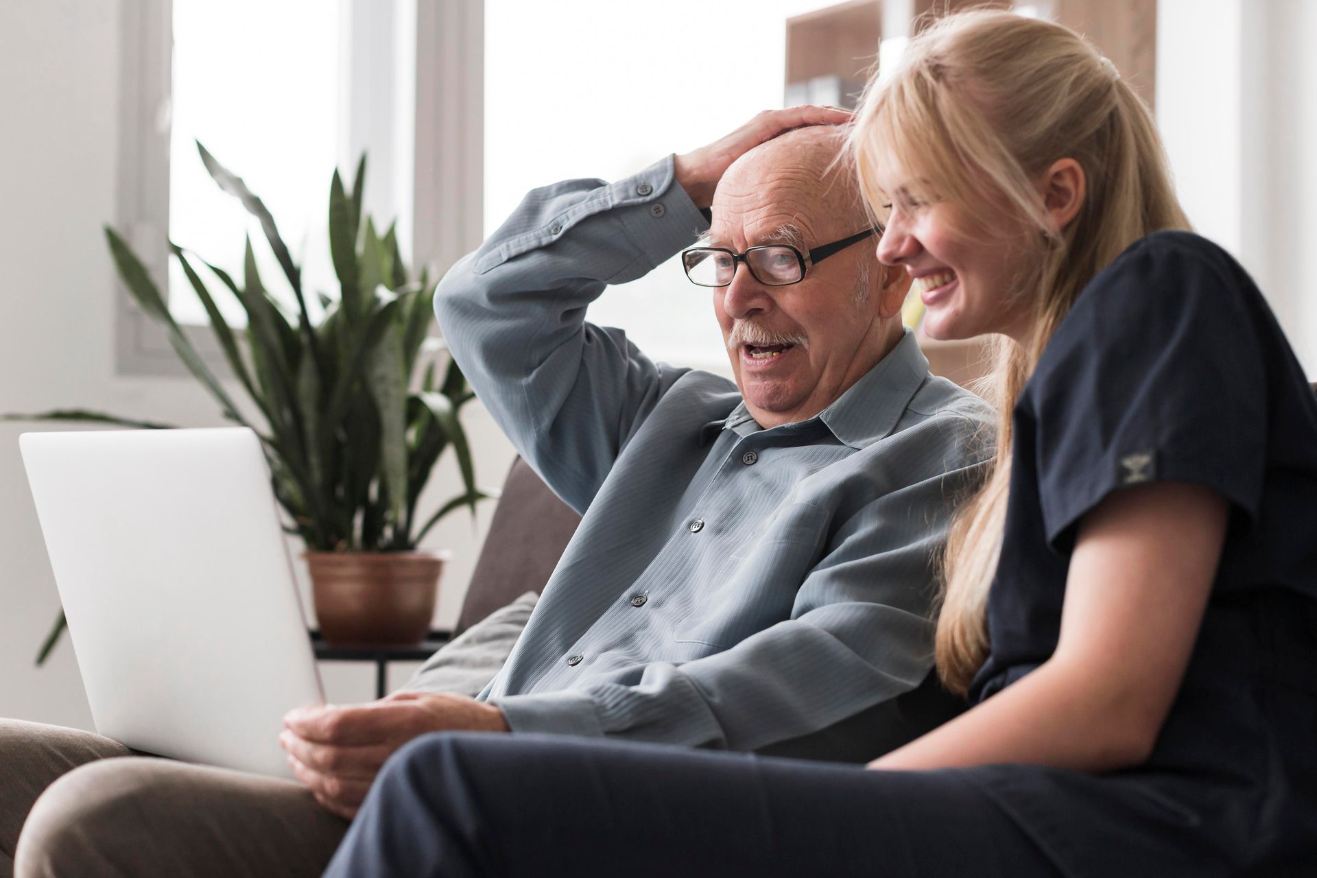 Caregiver supporting an elderly resident