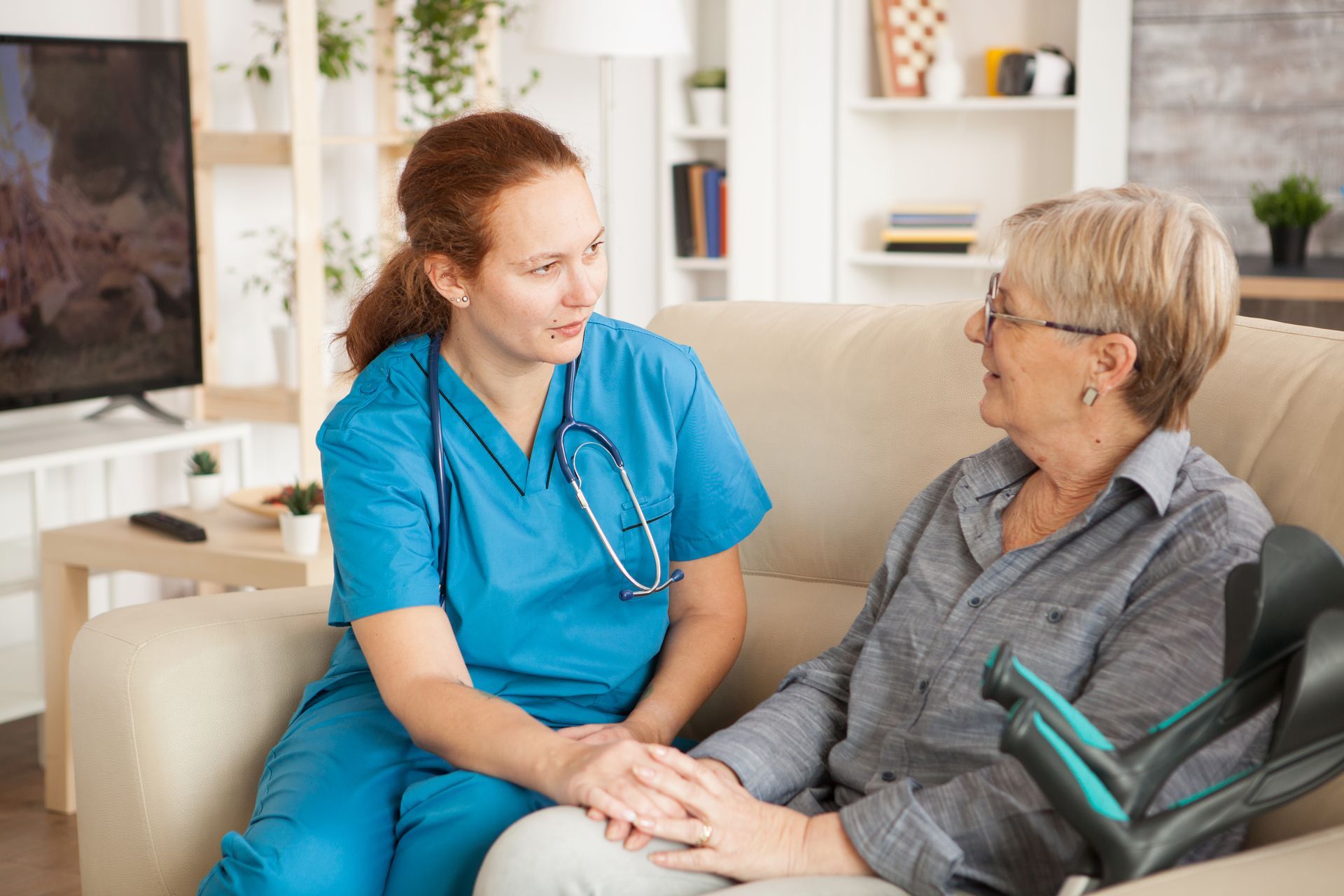 Nurse caring for an elderly patient