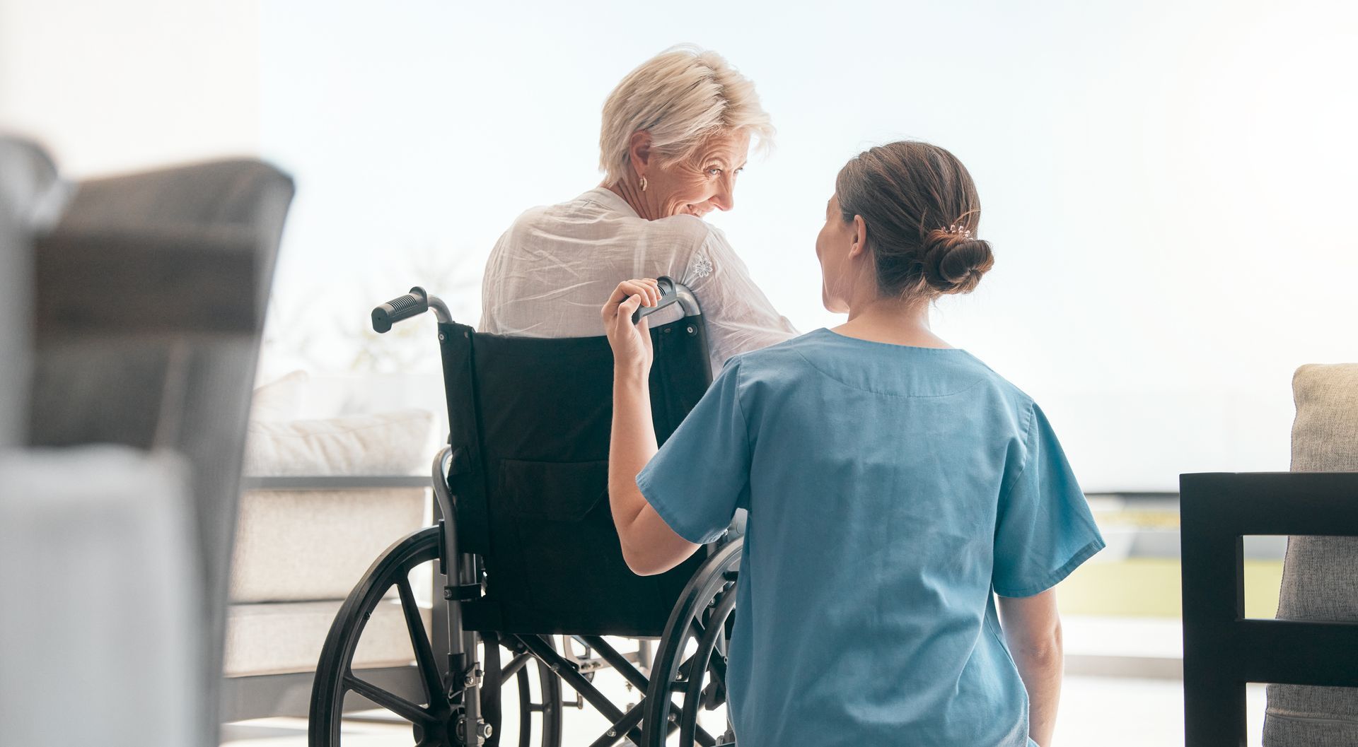 Therapist working with a patient in a wheelchair