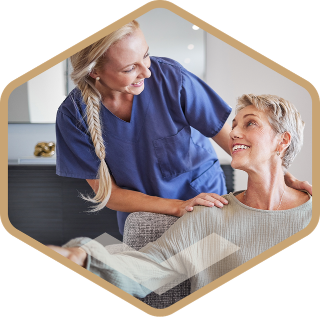 Caregiver with an elderly resident smiling